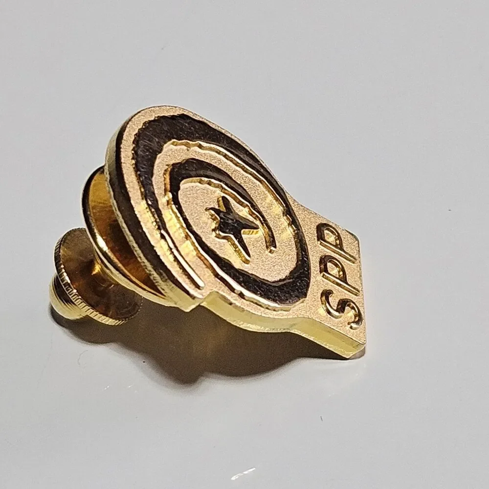 SPP Gold Tone Lapel Pin Featuring Star And Spiral Symbol Vintage Collectible
